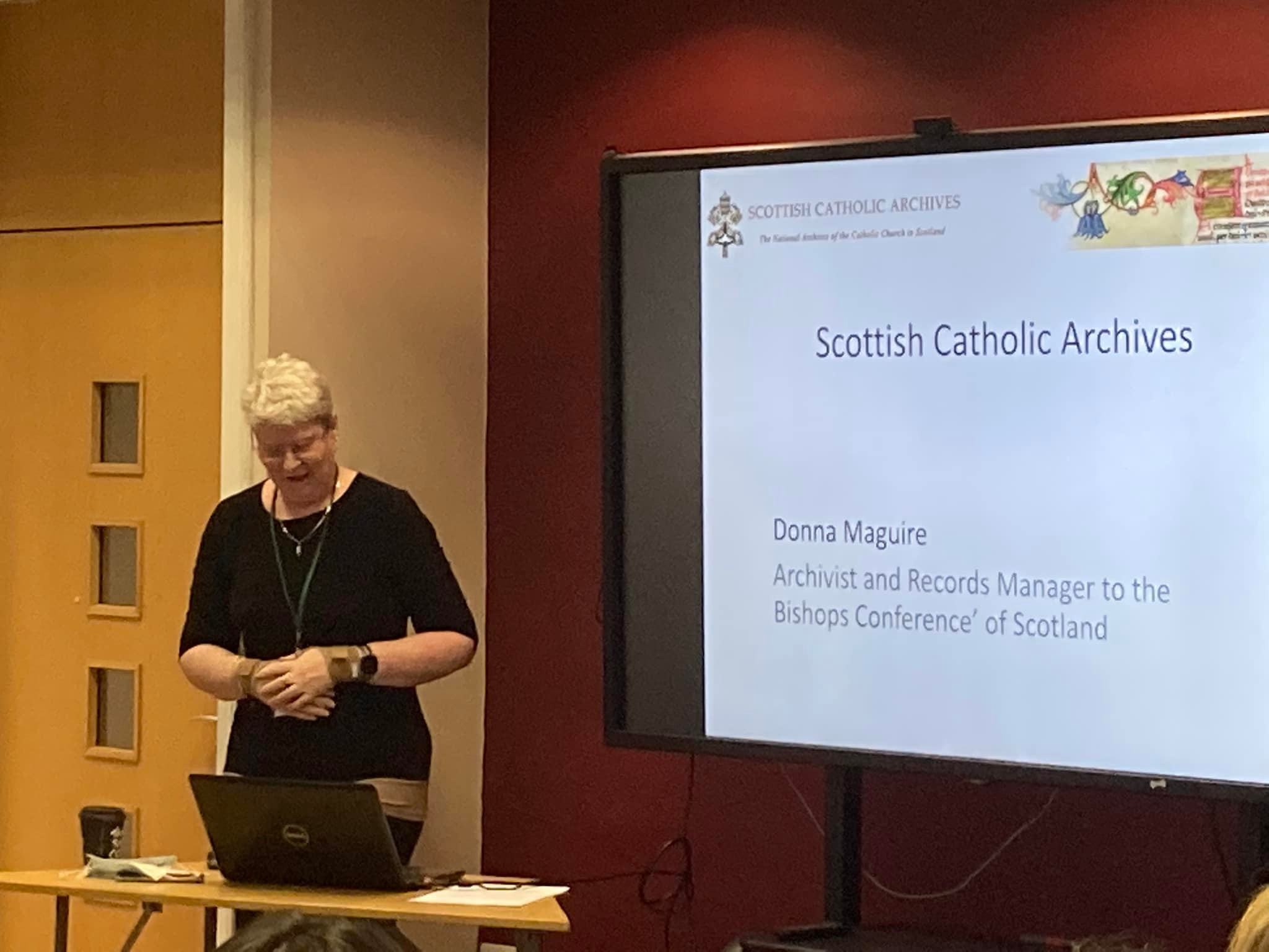 May be an image of 1 person, standing and text that says "SCOTTSHCATHOUICARCHIVES SCOTTISH CATHOLIC ARCHIVES ه @ Scottish Catholic Archives Donna Maguire Archivist and Records Manager to the Bishops Conference of Scotland"